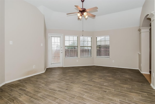 interior space featuring hardwood / wood-style flooring, vaulted ceiling, decorative columns, and ceiling fan