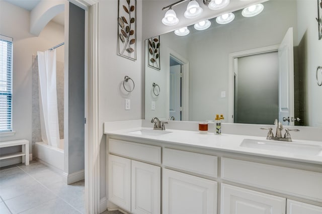 bathroom with tile patterned floors, vanity, and shower / bath combo