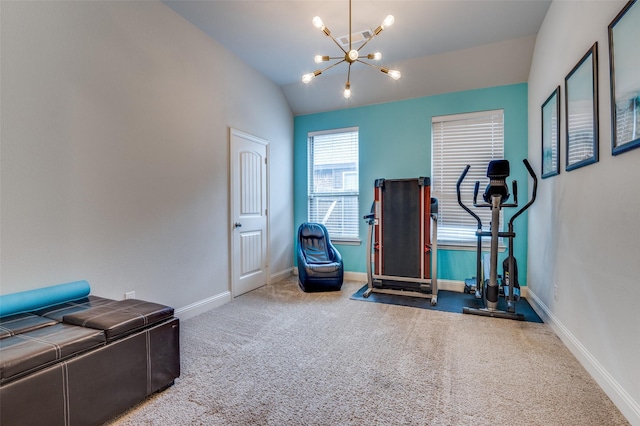 exercise room featuring lofted ceiling, carpet flooring, and an inviting chandelier