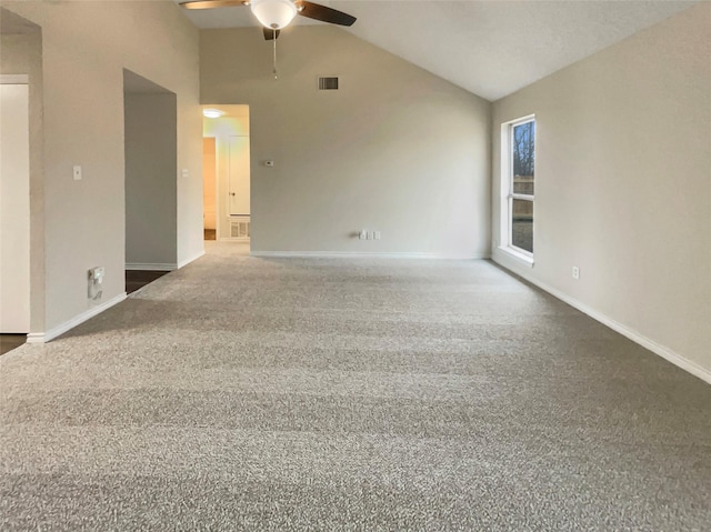 carpeted spare room with high vaulted ceiling and ceiling fan