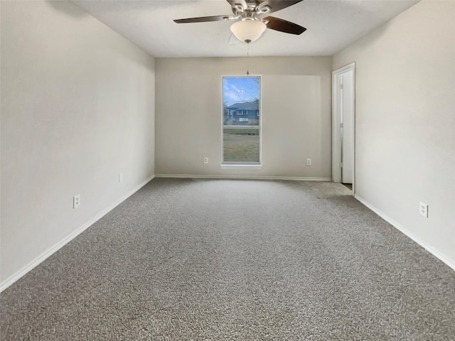 spare room with ceiling fan and carpet flooring