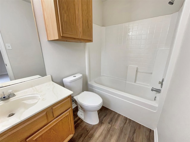 full bathroom with vanity, toilet, shower / washtub combination, and hardwood / wood-style floors