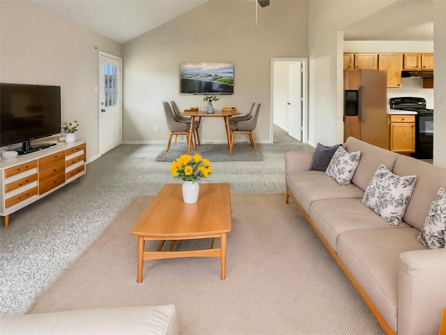 living room featuring light carpet and vaulted ceiling