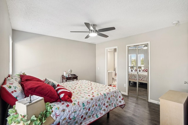 bedroom with ceiling fan, a textured ceiling, dark hardwood / wood-style flooring, and a closet