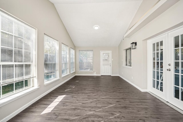 unfurnished sunroom featuring lofted ceiling and french doors