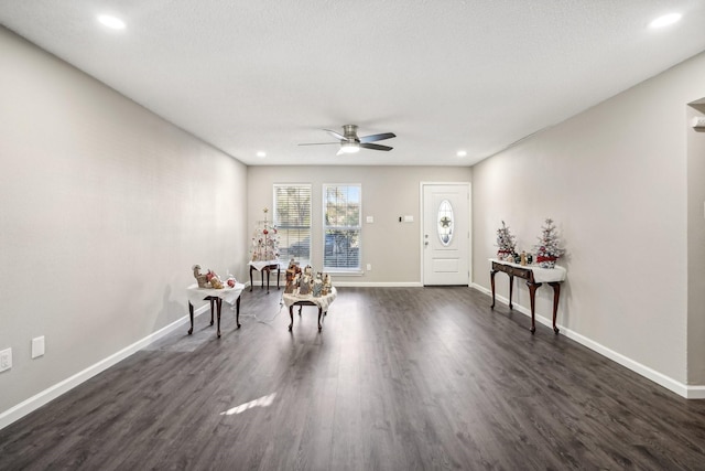 unfurnished room with dark hardwood / wood-style flooring and ceiling fan