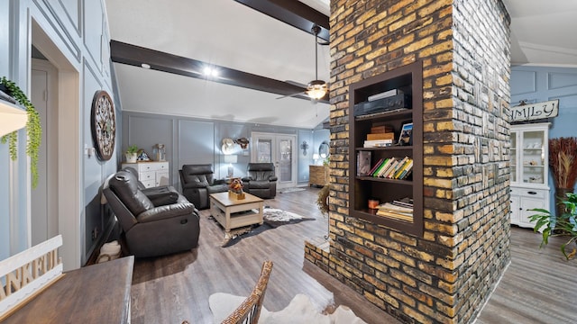 living room featuring hardwood / wood-style floors, beam ceiling, high vaulted ceiling, and ceiling fan