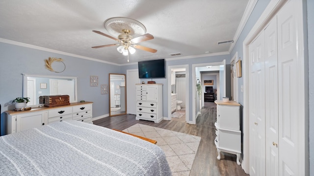 bedroom with crown molding, ensuite bathroom, ceiling fan, and light hardwood / wood-style flooring