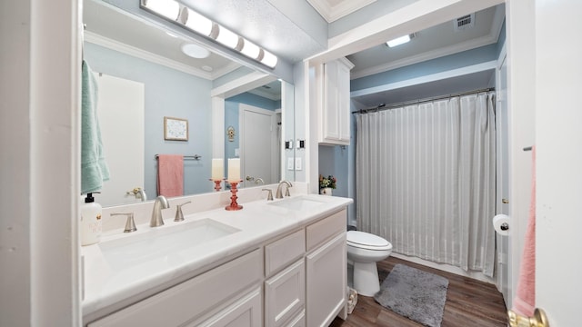 bathroom featuring walk in shower, toilet, crown molding, vanity, and hardwood / wood-style flooring