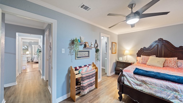 bedroom with crown molding, ceiling fan, and light wood-type flooring