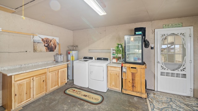 laundry area with water heater, washer and clothes dryer, and cabinets