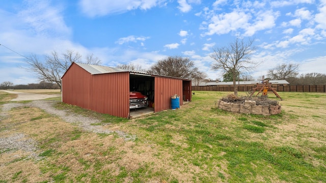 view of outbuilding with a yard and a playground