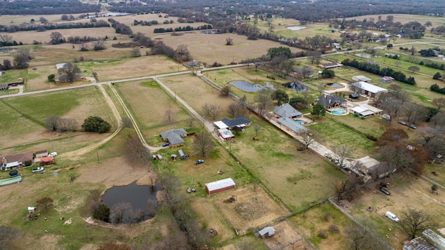 bird's eye view featuring a water view and a rural view