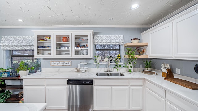 kitchen with ornamental molding, dishwasher, sink, and white cabinets