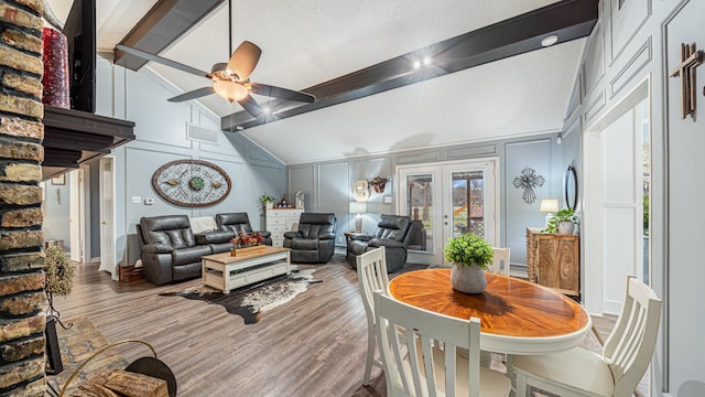 dining area with beam ceiling, hardwood / wood-style flooring, high vaulted ceiling, and french doors