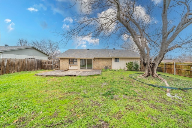 rear view of property with a yard