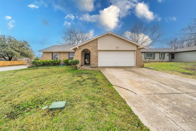 ranch-style house with a garage and a front lawn