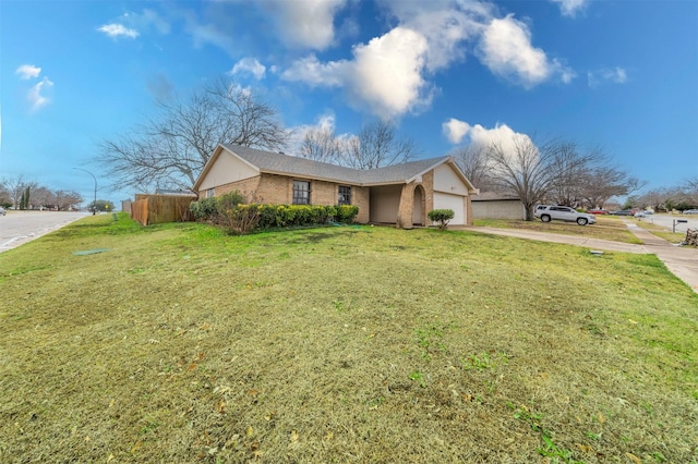 single story home with a garage and a front yard