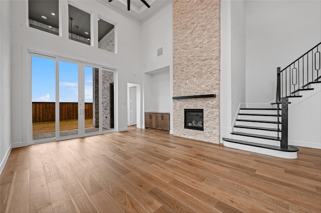 unfurnished living room featuring hardwood / wood-style floors and a fireplace