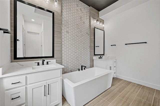 bathroom featuring a bathing tub and vanity