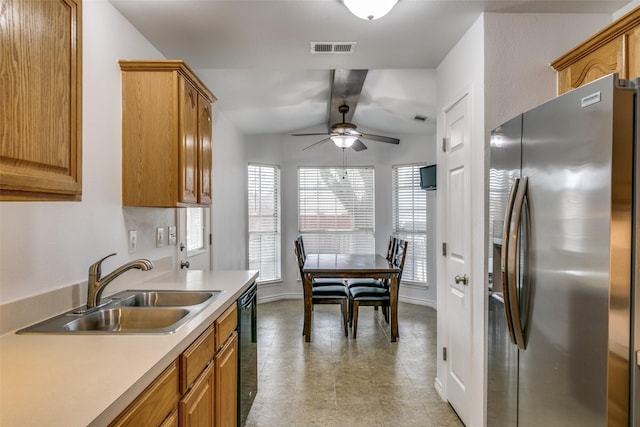 kitchen featuring black dishwasher, stainless steel refrigerator with ice dispenser, light countertops, visible vents, and a sink