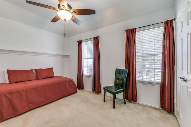 bedroom featuring carpet floors, vaulted ceiling, and ceiling fan