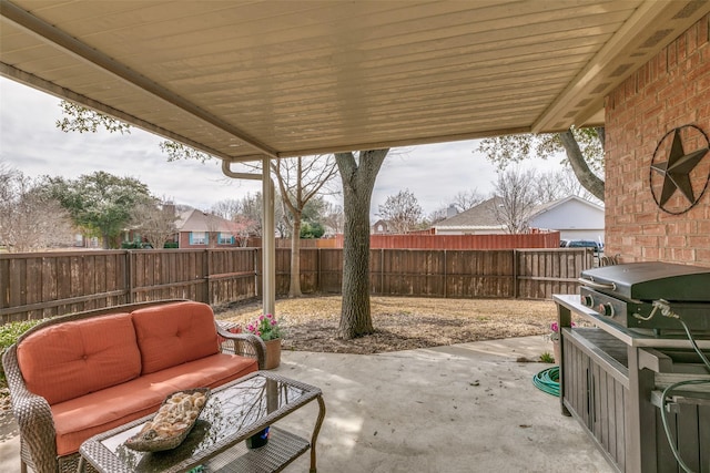 view of patio with a fenced backyard and outdoor lounge area