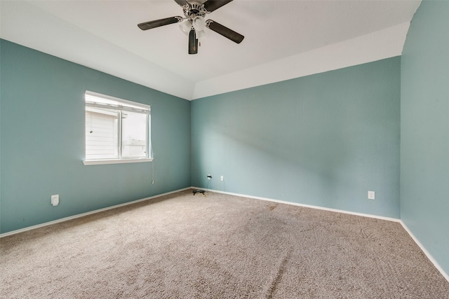 spare room with carpet floors and ceiling fan