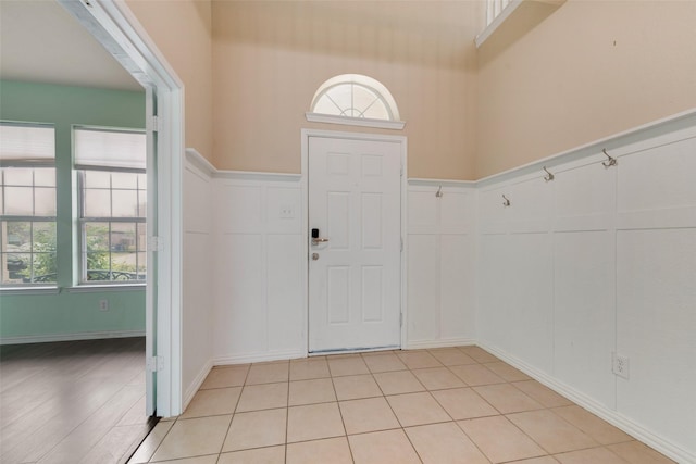 entryway with a towering ceiling