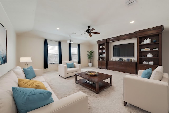 living room featuring ceiling fan and light colored carpet