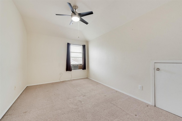 unfurnished room featuring ceiling fan, light colored carpet, vaulted ceiling, and cooling unit