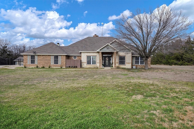 ranch-style home with a front yard