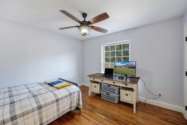 bedroom featuring wood-type flooring and ceiling fan