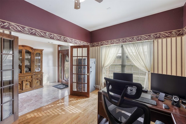 office space featuring french doors and ceiling fan