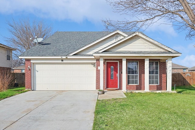 view of front of property featuring a garage and a front yard