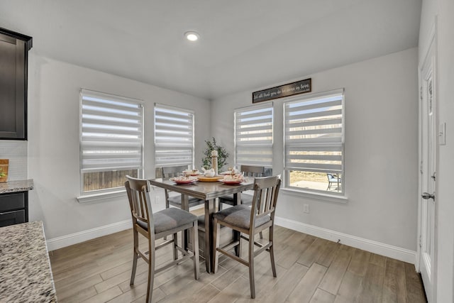 dining area featuring recessed lighting, light wood-type flooring, and baseboards