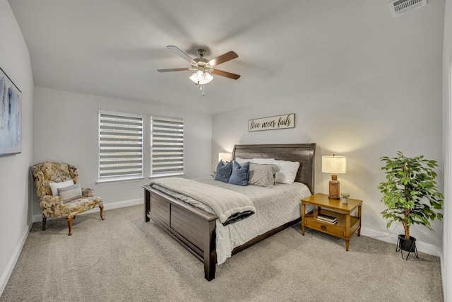 bedroom featuring a ceiling fan, baseboards, visible vents, and carpet flooring