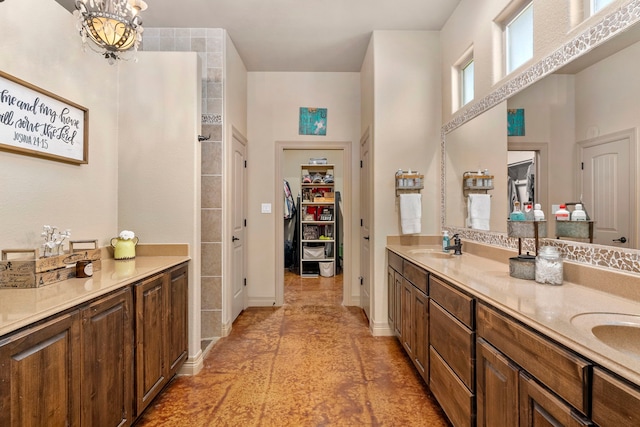 bathroom featuring vanity and a notable chandelier