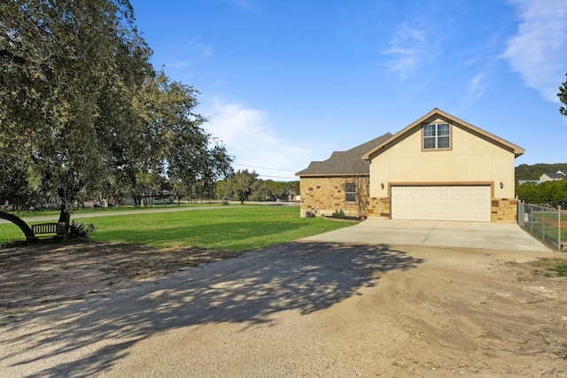 view of front of house featuring a garage and a front yard