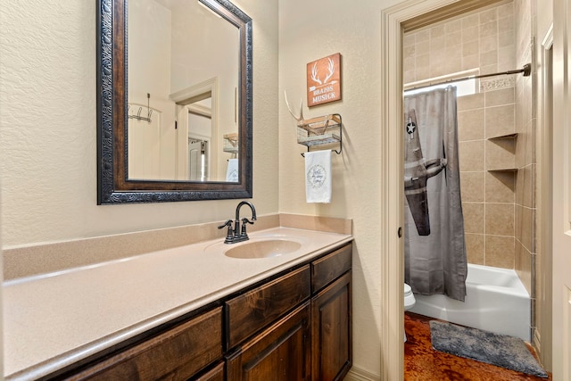 full bathroom featuring vanity, shower / bath combo, and toilet