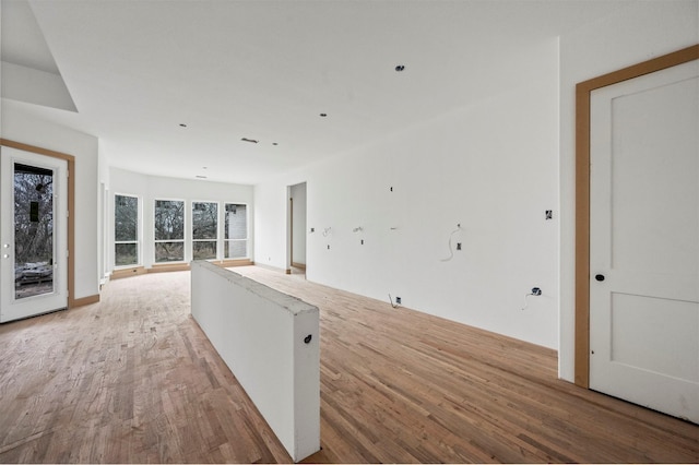 unfurnished living room featuring light wood-type flooring