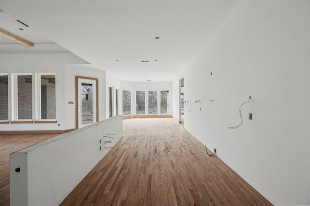 hall with hardwood / wood-style flooring