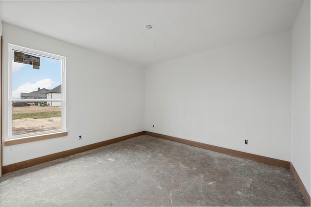 spare room with concrete flooring