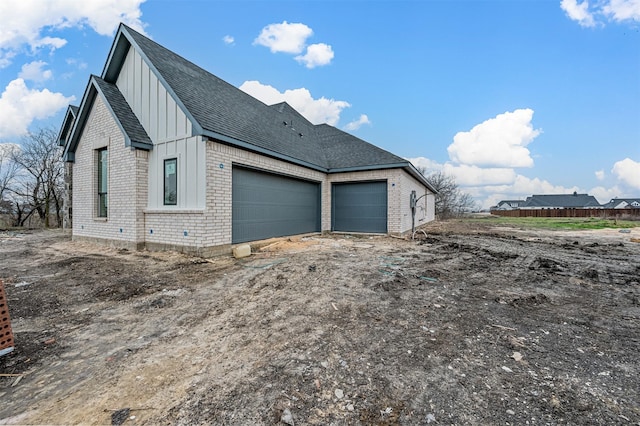 view of side of property featuring a garage