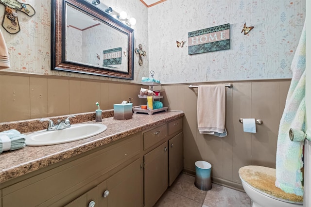 bathroom featuring vanity, tile patterned flooring, and toilet