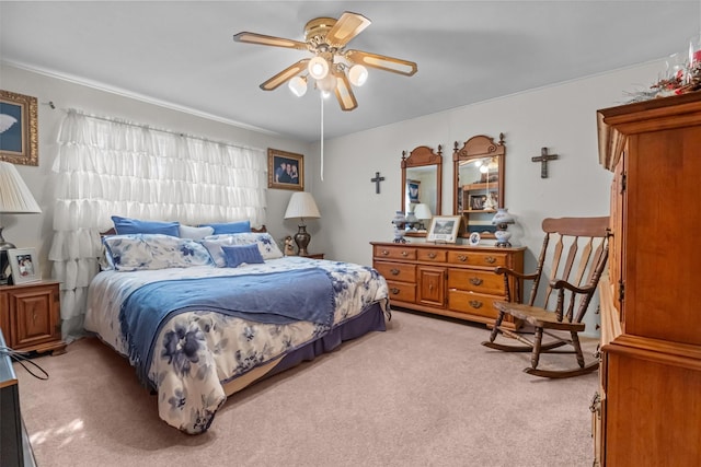 bedroom featuring ceiling fan and light carpet