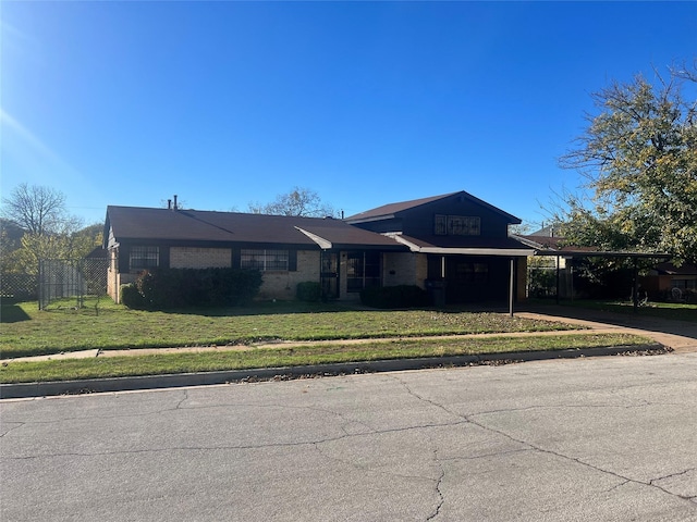 ranch-style house with a carport and a front yard