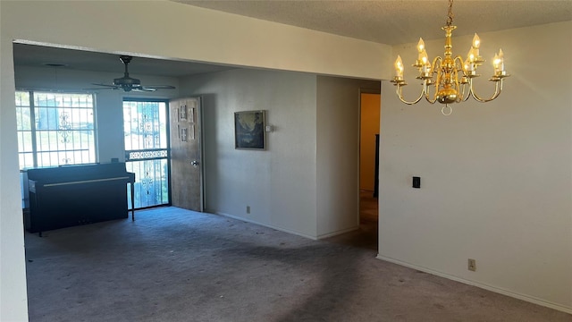 unfurnished room with carpet and ceiling fan with notable chandelier