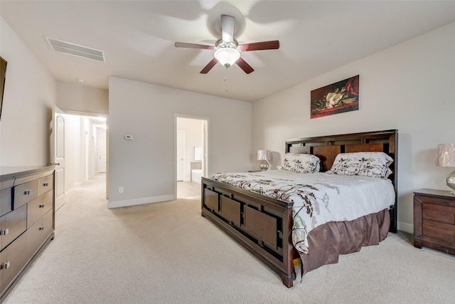 carpeted bedroom featuring ceiling fan and ensuite bathroom