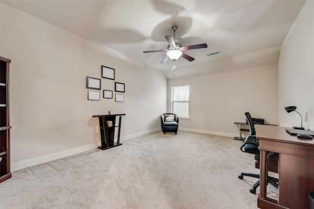 carpeted home office featuring ceiling fan and lofted ceiling